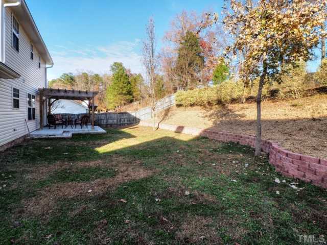 5645 Lighthall Lane Raleigh, NC 27604 - Photo 20 of 25 a view of a house with a yard