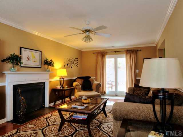 5645 Lighthall Lane Raleigh, NC 27604 - Photo 2 of 25 a living room with furniture and a fireplace