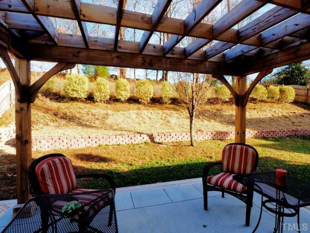 5645 Lighthall Lane Raleigh, NC 27604 - Photo 21 of 25 a view of a porch with furniture and a yard