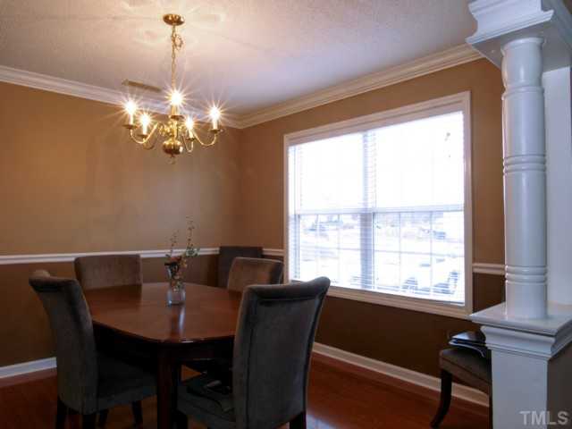 5645 Lighthall Lane Raleigh, NC 27604 - Photo 4 of 25 a view of a dining room with furniture window and outside view