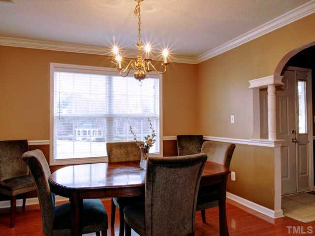 5645 Lighthall Lane Raleigh, NC 27604 - Photo 5 of 25 a view of a dining room with furniture window and outside view