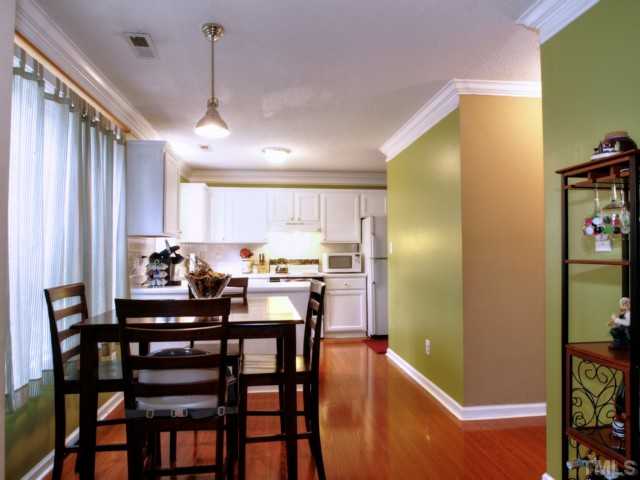 5645 Lighthall Lane Raleigh, NC 27604 - Photo 6 of 25 a view of a dining room with furniture and window