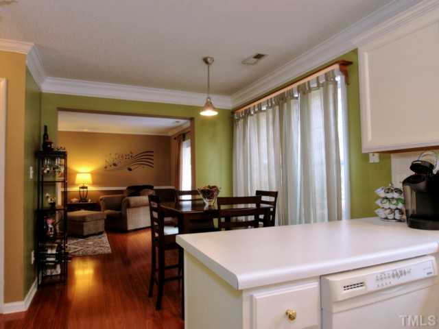 5645 Lighthall Lane Raleigh, NC 27604 - Photo 8 of 25 a kitchen with counter top space and wooden floor