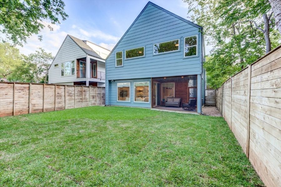 916 East 50th Street, Unit 1 Austin, TX 78751 - Photo 10 of 36 Large, flat backyard is fully fenced and sodded and could easily accommodate a pool + more.
