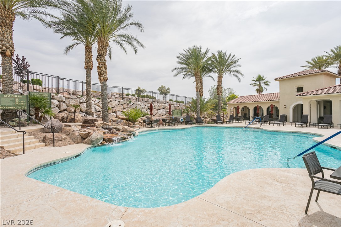 2555 Hampton Road, Unit 3308 Henderson, NV 89052 - Photo 61 of 65 An inviting resort-style pool with cascading water features and ample lounging space.