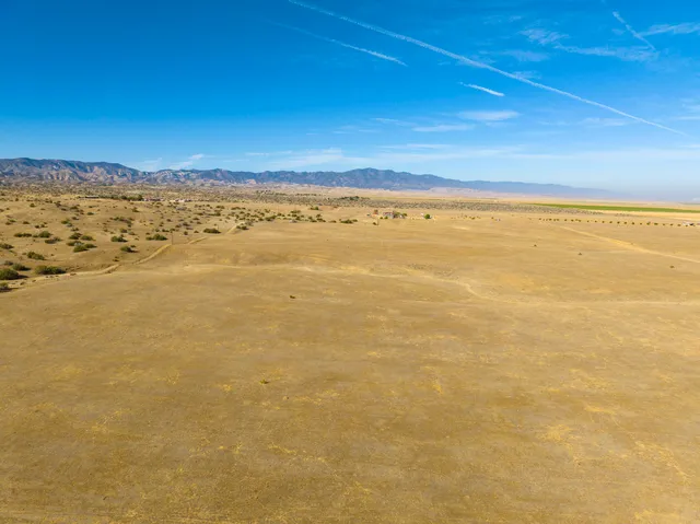 an ocean beach with an outdoor seating
