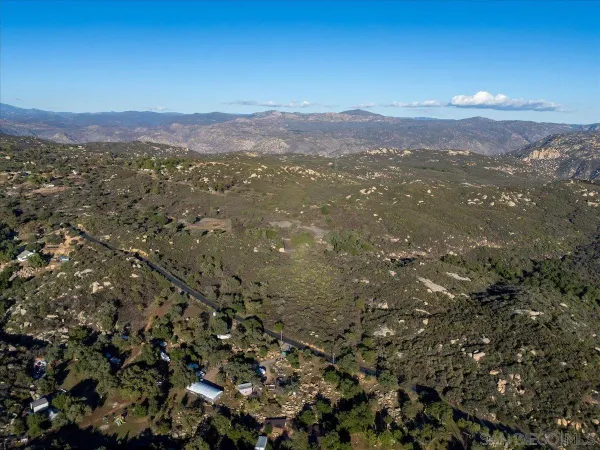a view of a city with mountains in the background