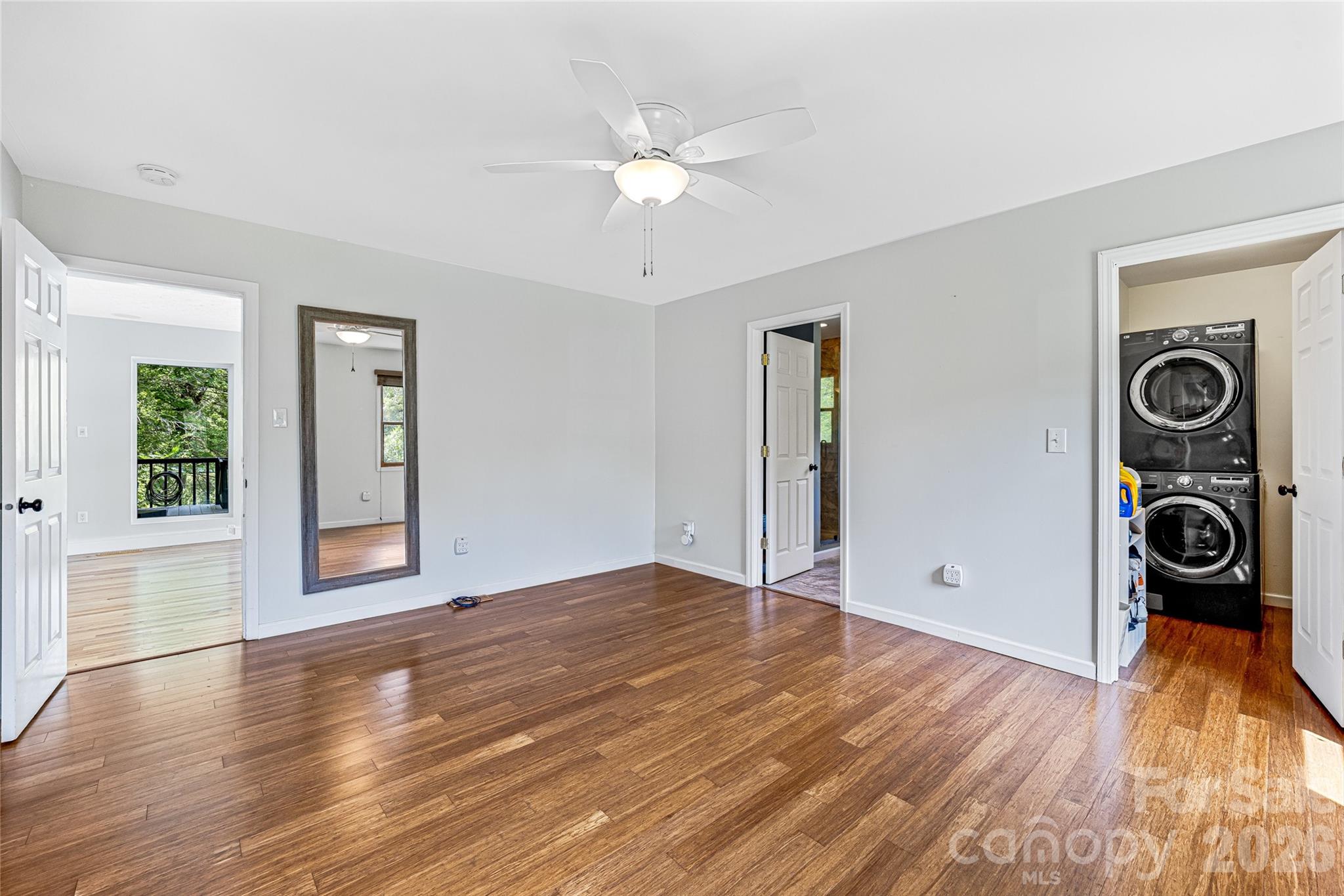 48 Merrell Road Leicester, NC 28748 - Photo 12 of 28 an empty room with wooden floor closet and windows