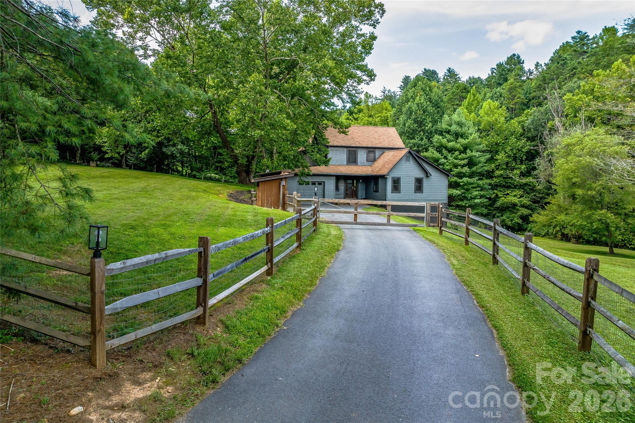48 Merrell Road Leicester, NC 28748 - Photo 19 of 28 a view of a house with a backyard