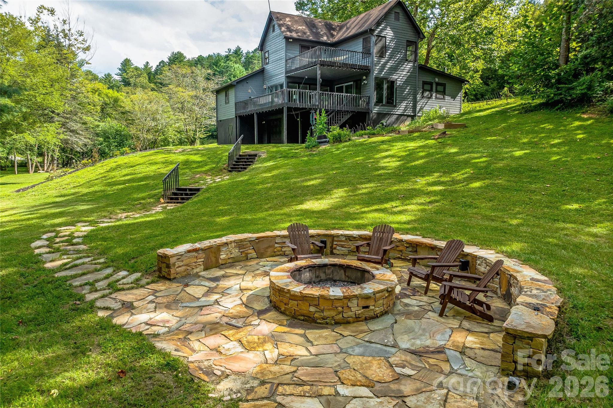 48 Merrell Road Leicester, NC 28748 - Photo 2 of 28 a view of an house with backyard space and patio