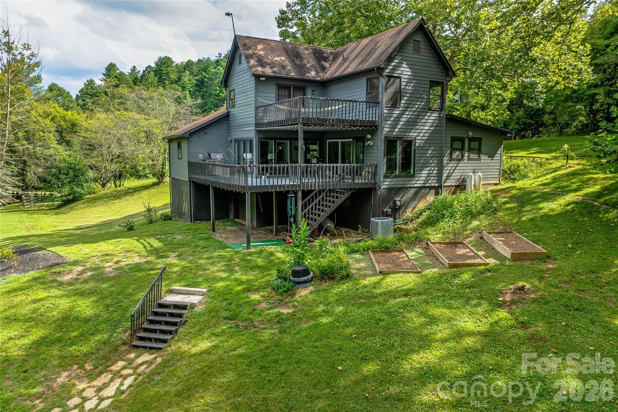 48 Merrell Road Leicester, NC 28748 - Photo 4 of 28 a view of a house with a yard balcony and sitting area