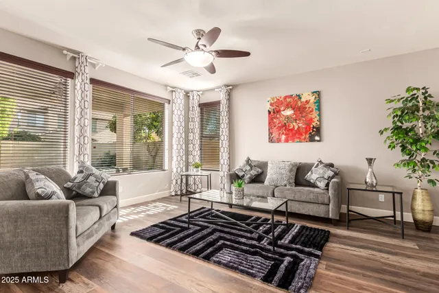 a large kitchen with stainless steel appliances a stove a sink dishwasher and a fireplace with wooden floor