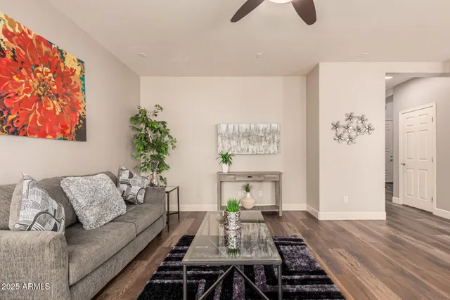 a kitchen with stainless steel appliances granite countertop a sink refrigerator and cabinets
