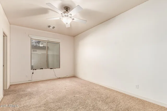 an empty room with a bathroom