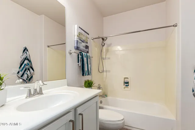 a front view of a house with a yard table and chairs