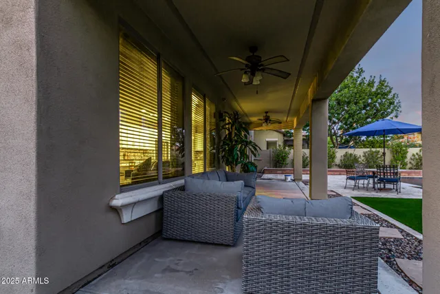 a view of a house with a yard porch and sitting area