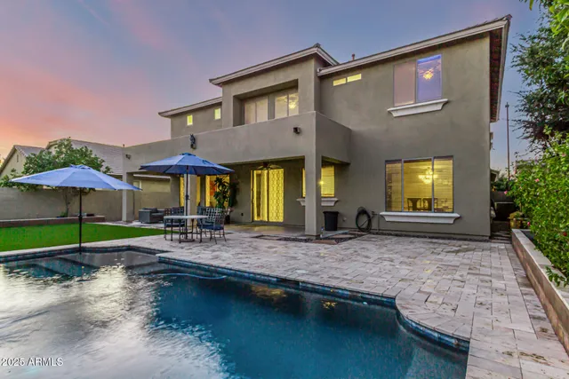 a view of a house with a yard porch and sitting area