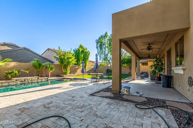 a view of a white house with a yard