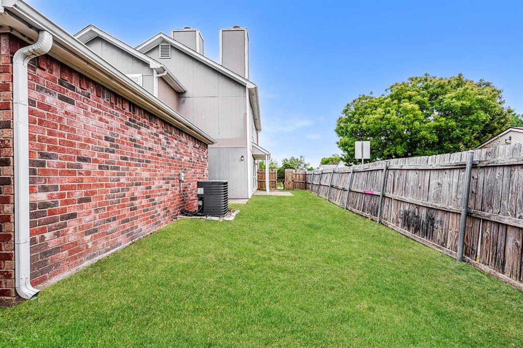 1401 Del Rio Drive Mesquite, TX 75149 - Photo 14 of 17 a view of a backyard with a garden