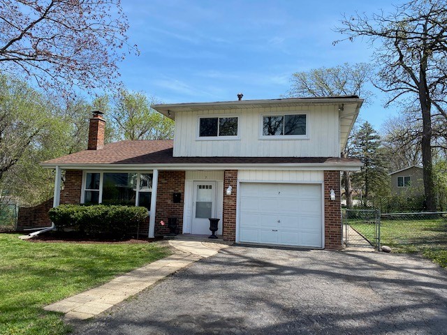 7 Treebark Court Schaumburg, IL 60193 - Photo 1 of 29 a view of a house with a garden and yard