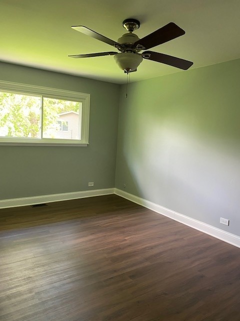 7 Treebark Court Schaumburg, IL 60193 - Photo 17 of 29 en empty room with wooden floor and windows