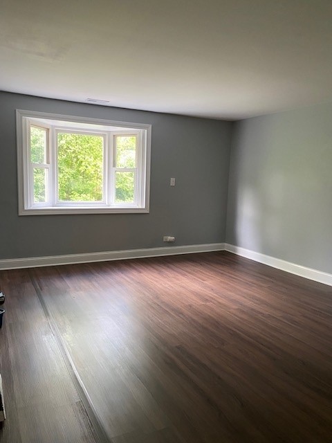 7 Treebark Court Schaumburg, IL 60193 - Photo 19 of 29 an empty room with wooden floor and windows