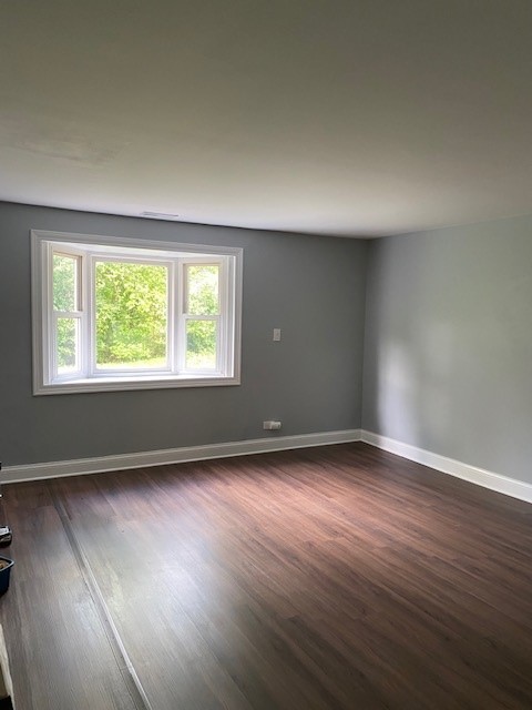 7 Treebark Court Schaumburg, IL 60193 - Photo 20 of 29 a view of an empty room with wooden floor and a window