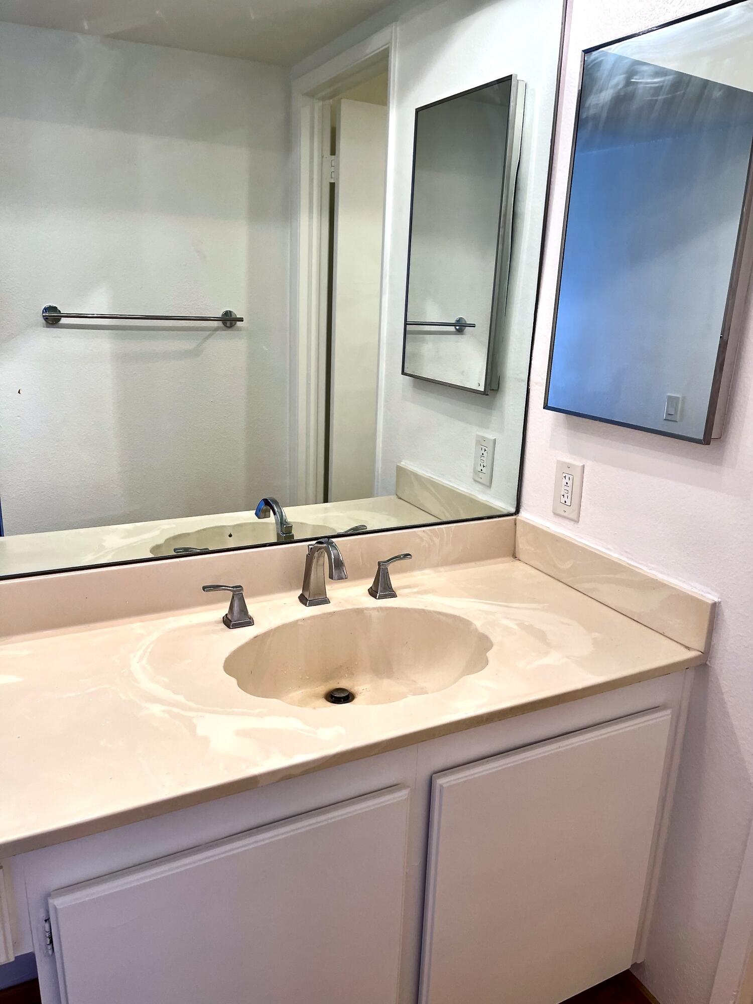 310 East San Jose Road, Unit 110 Palm Springs, CA 92264 - Photo 13 of 34 a bathroom with a sink and a mirror