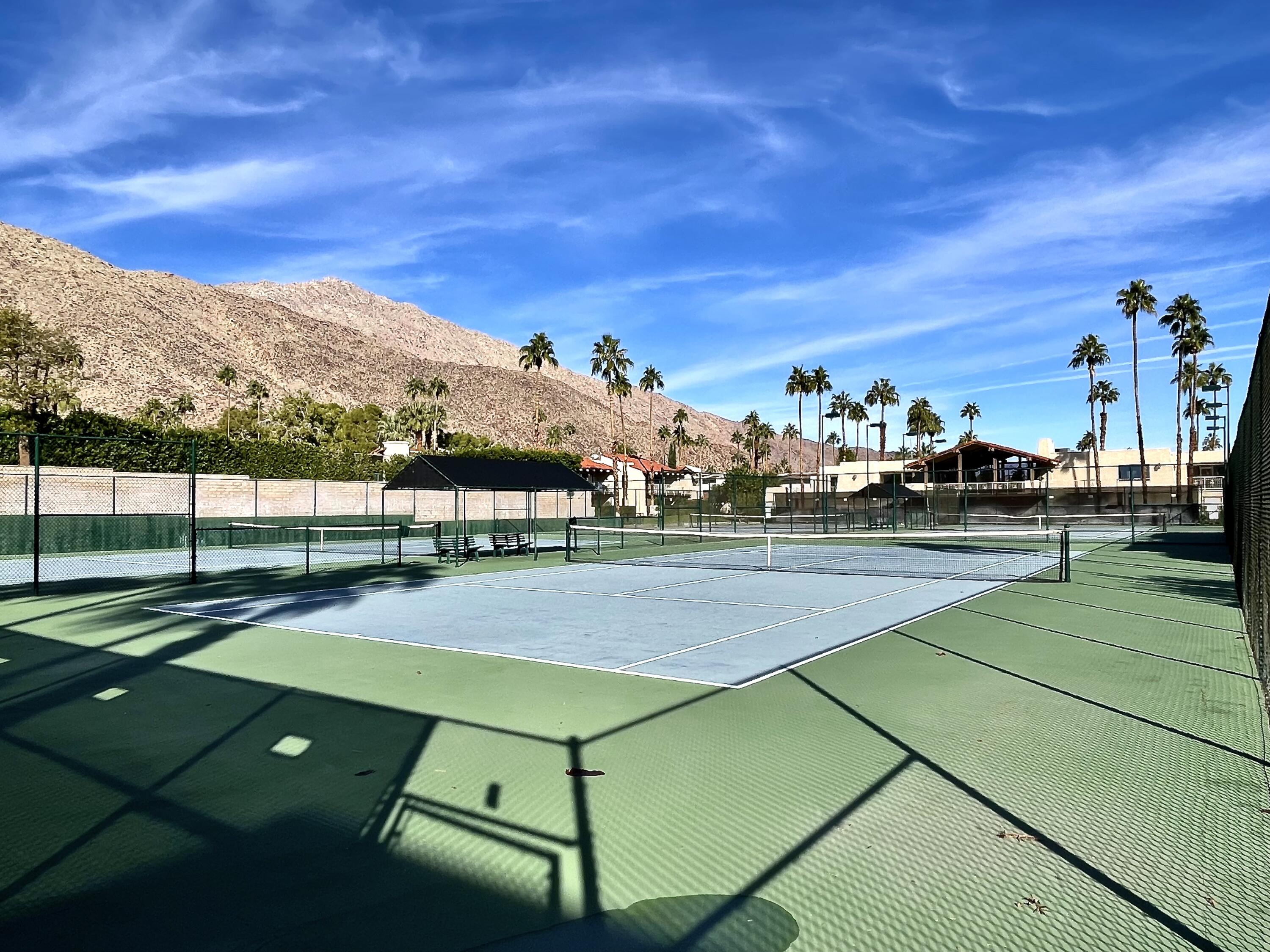 310 East San Jose Road, Unit 110 Palm Springs, CA 92264 - Photo 28 of 34 a view of an outdoor space and tennis court