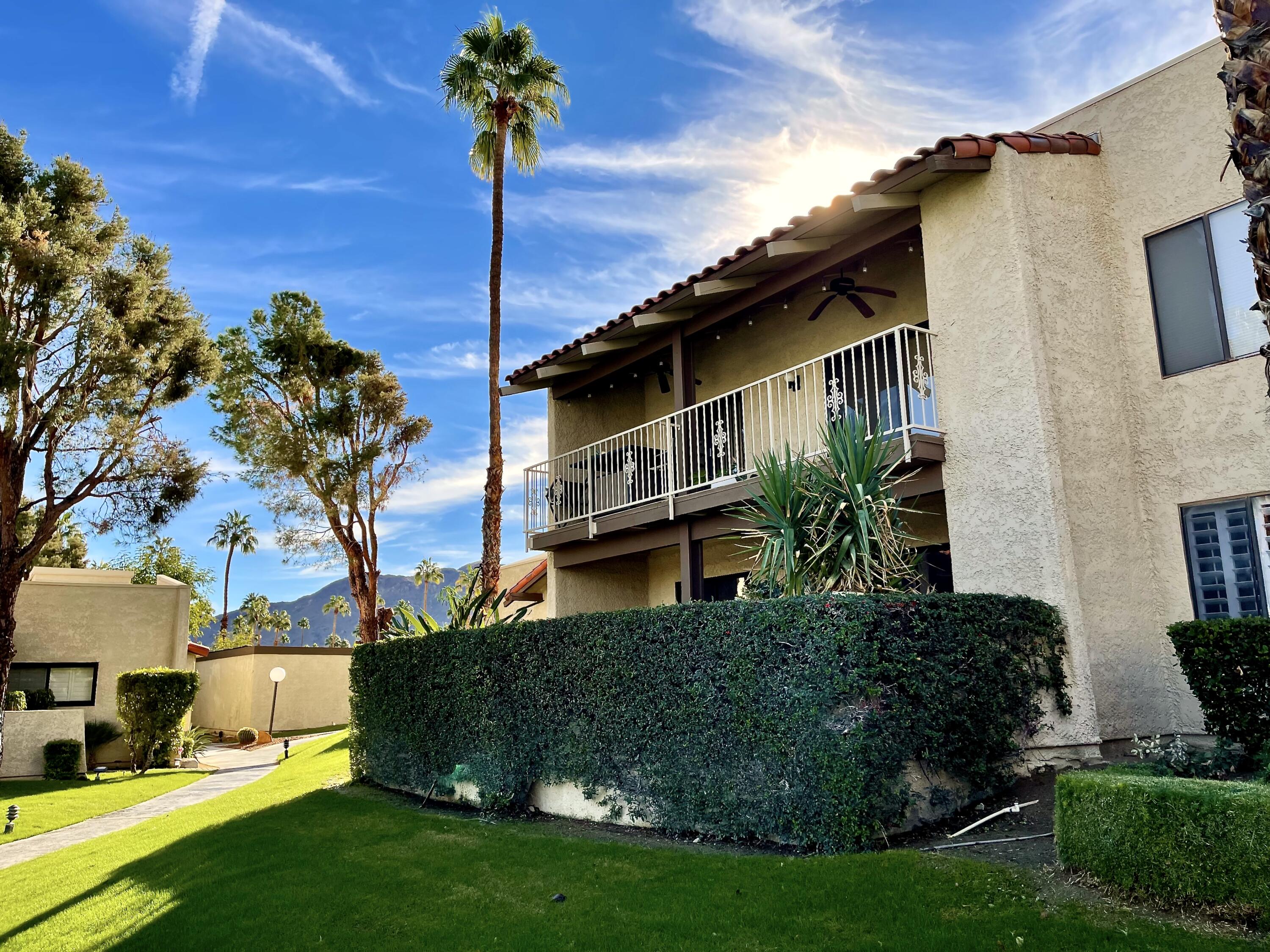 310 East San Jose Road, Unit 110 Palm Springs, CA 92264 - Photo 31 of 34 a front view of a house with garden