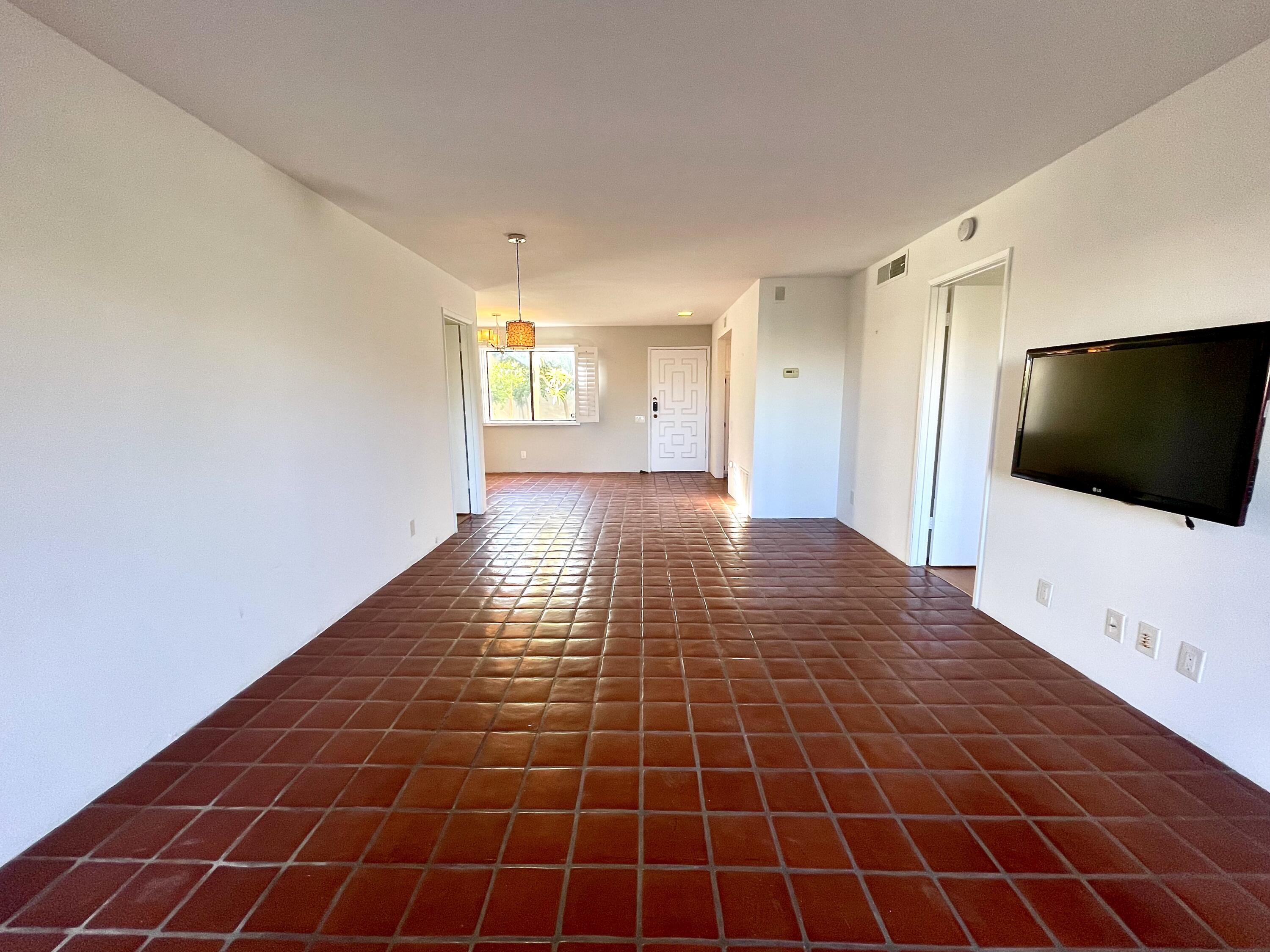 310 East San Jose Road, Unit 110 Palm Springs, CA 92264 - Photo 5 of 34 a view of a living room with a flat screen tv