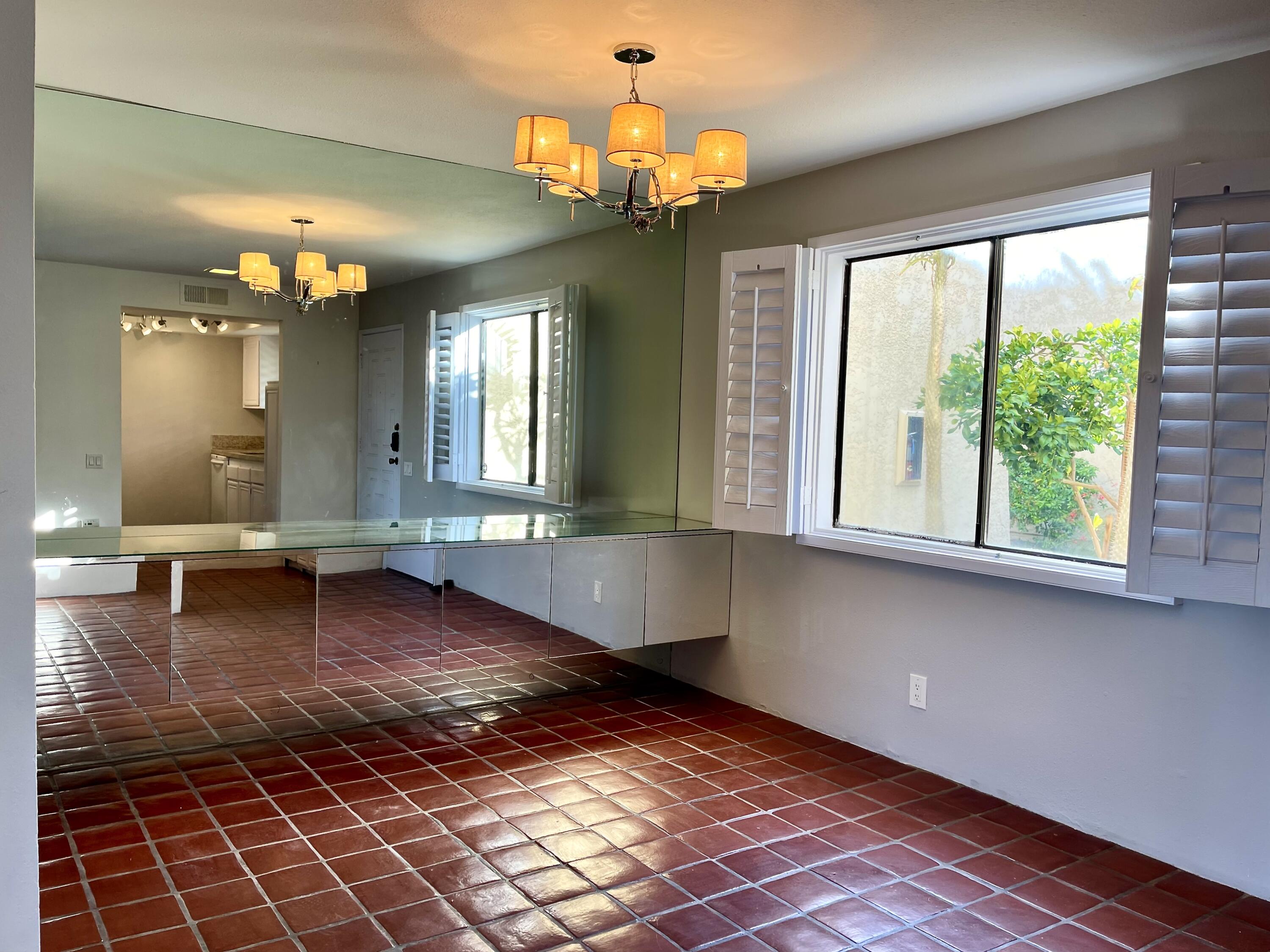 310 East San Jose Road, Unit 110 Palm Springs, CA 92264 - Photo 7 of 34 a lobby with furniture and window