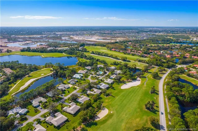 a view of a swimming pool and an outdoor seating