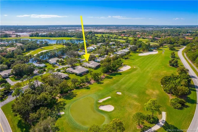 a view of a swimming pool and an outdoor seating