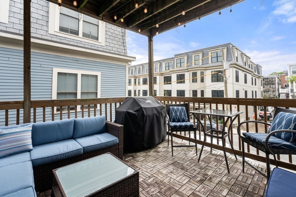 52 O Street, Unit 3 Boston, MA 02127 - Photo 13 of 15 a front view of a house with outdoor seating