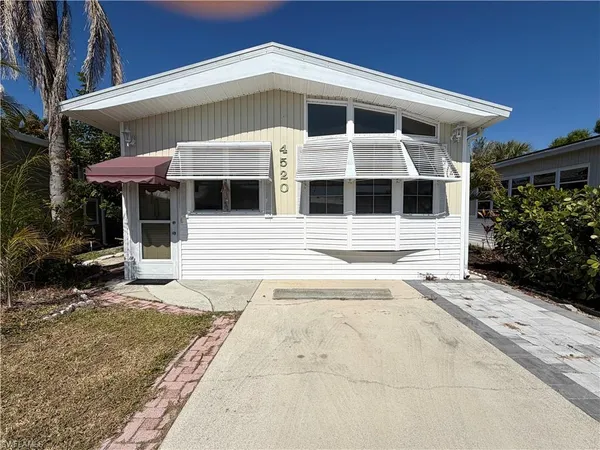 a front view of a house with garage