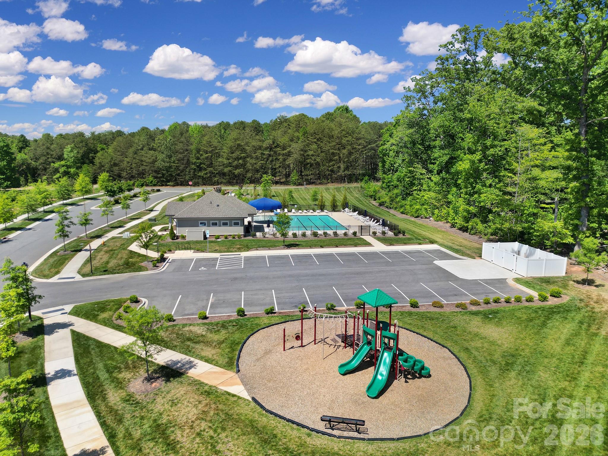 107 Spring Hall Court Troutman, NC 28166 - Photo 2 of 28 a view of a swimming pool with a yard