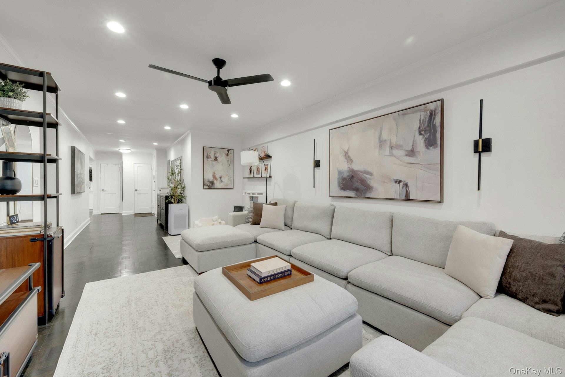 609 Palmer Road, Unit 2J Yonkers, NY 10701 - Photo 11 of 23 a living room with furniture and a ceiling fan