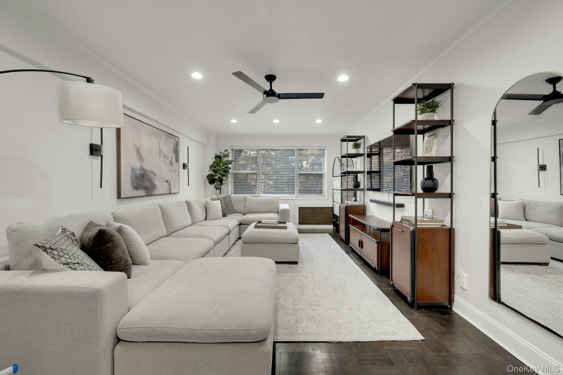 609 Palmer Road, Unit 2J Yonkers, NY 10701 - Photo 12 of 23 a living room with furniture and a book shelf