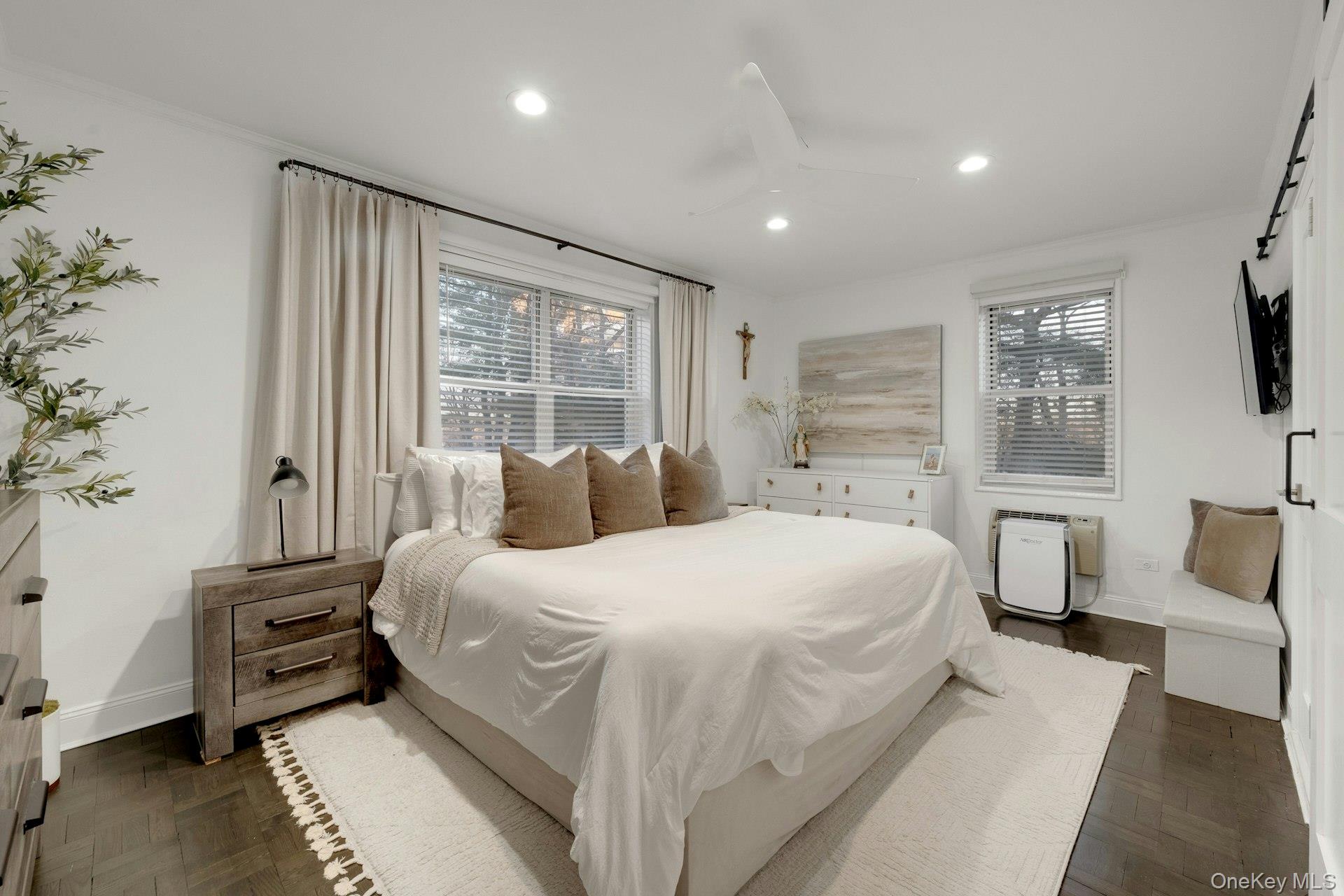 609 Palmer Road, Unit 2J Yonkers, NY 10701 - Photo 14 of 23 a bedroom with a large bed and a tv