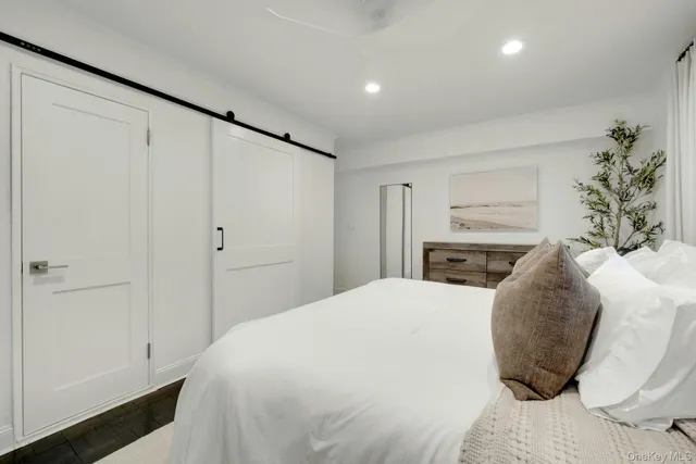 a bedroom with a bed and a closet