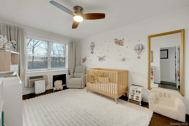 a bedroom with furniture and a fireplace
