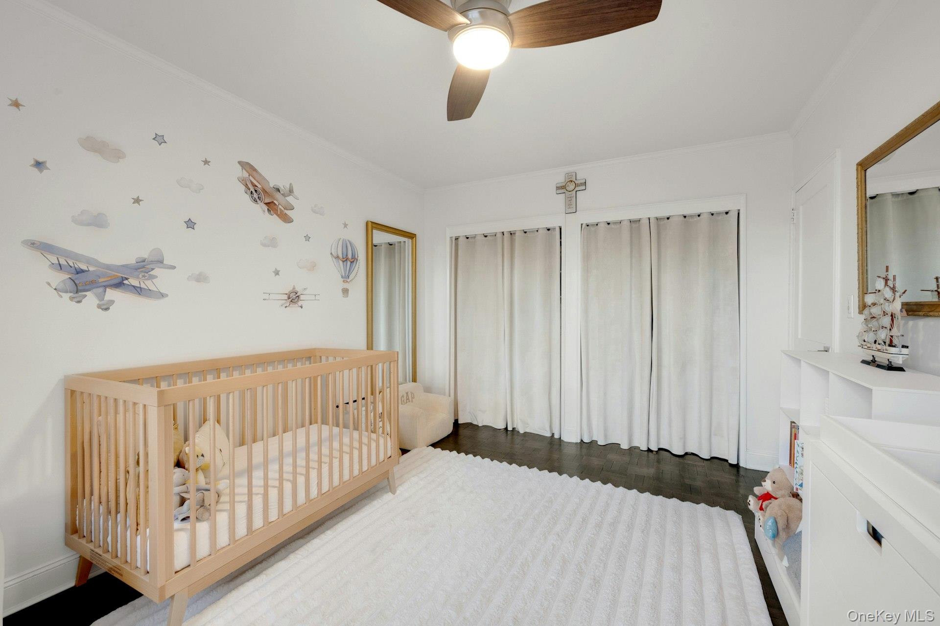 609 Palmer Road, Unit 2J Yonkers, NY 10701 - Photo 19 of 23 a bedroom with a bed and a chandelier