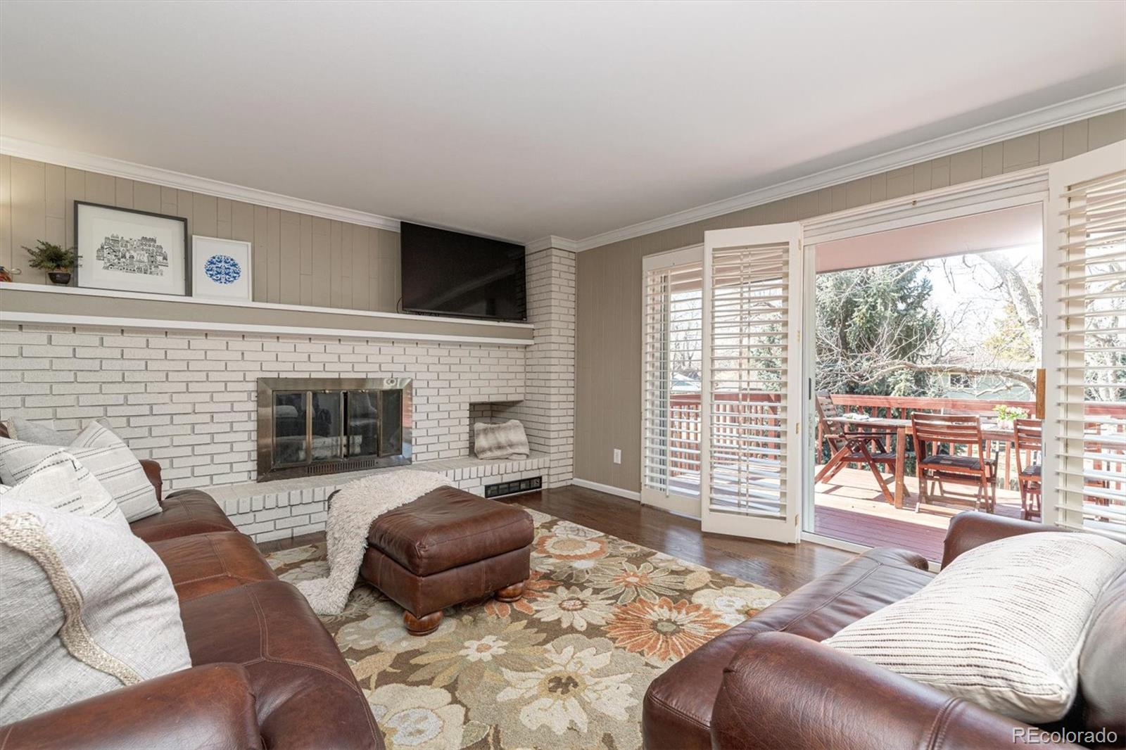 6145 South Eudora Way Centennial, CO 80121 - Photo 14 of 33 a living room with furniture large window and fireplace