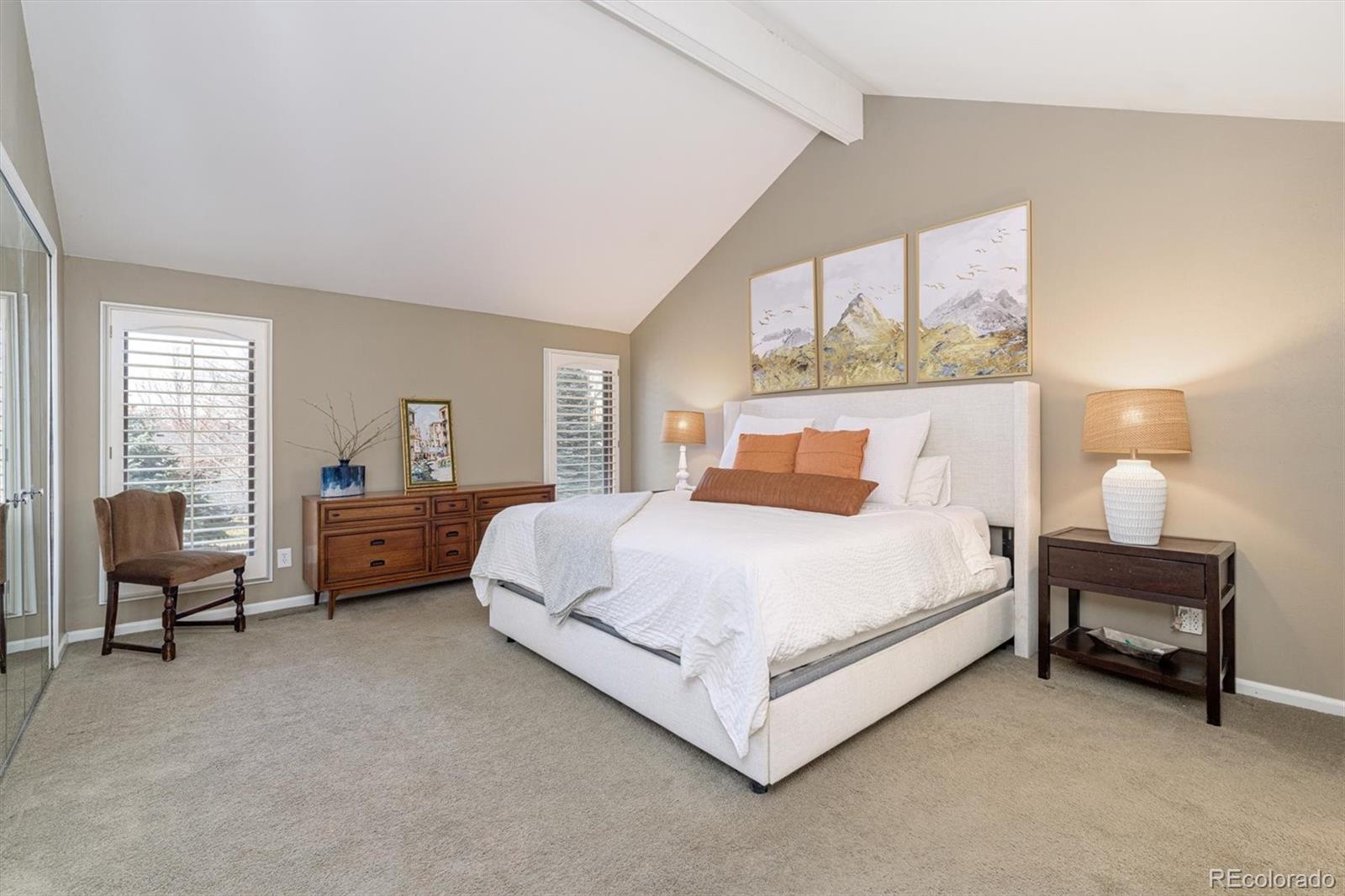 6145 South Eudora Way Centennial, CO 80121 - Photo 18 of 33 a bedroom with a bed and a couch