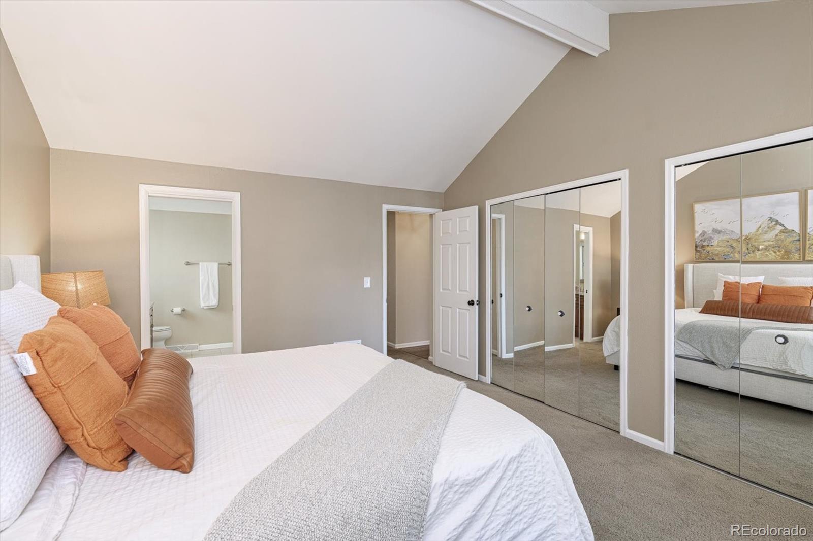 6145 South Eudora Way Centennial, CO 80121 - Photo 19 of 33 a bedroom with a bed and a large window