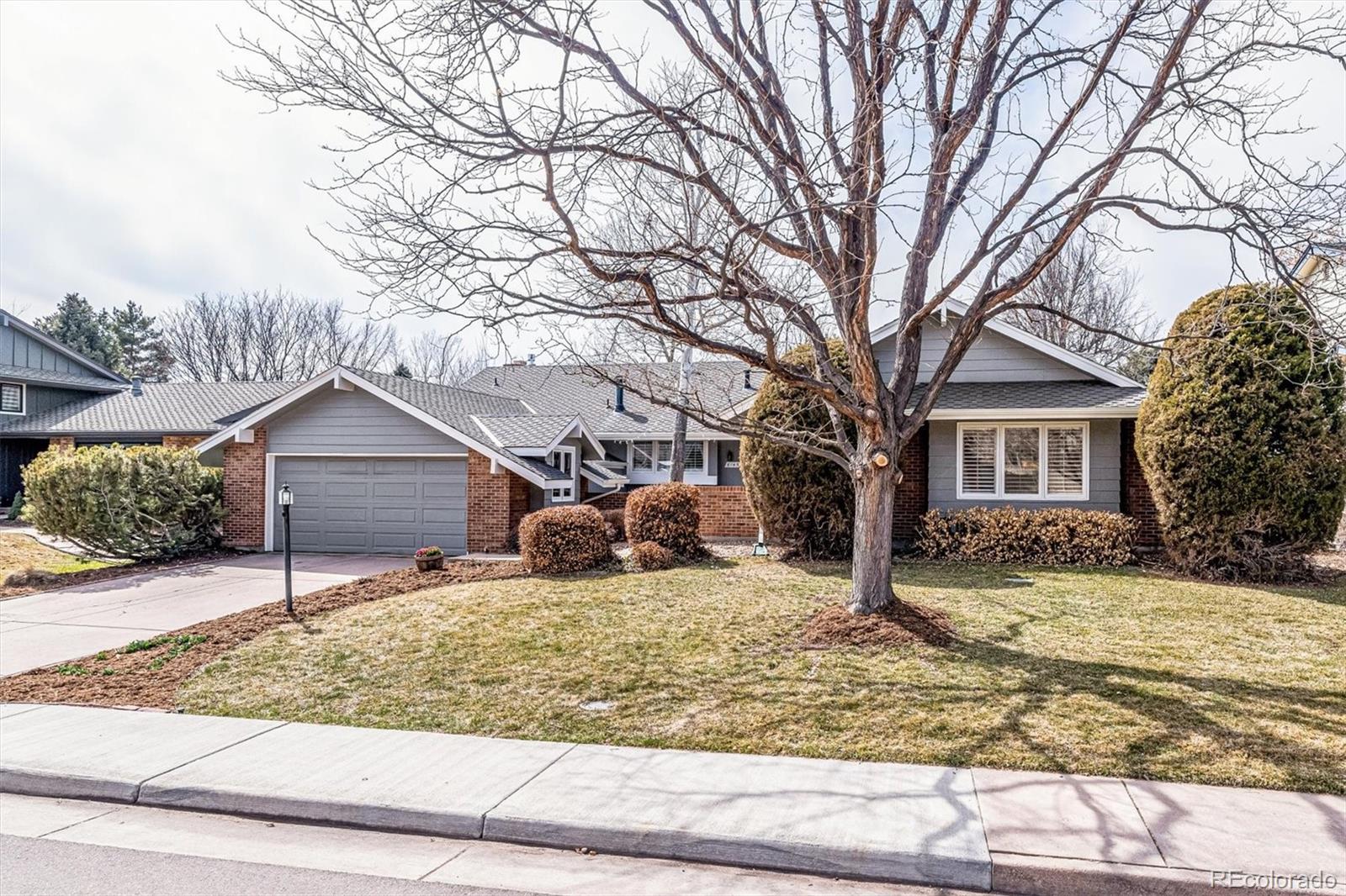 6145 South Eudora Way Centennial, CO 80121 - Photo 2 of 33 front view of a house with a yard