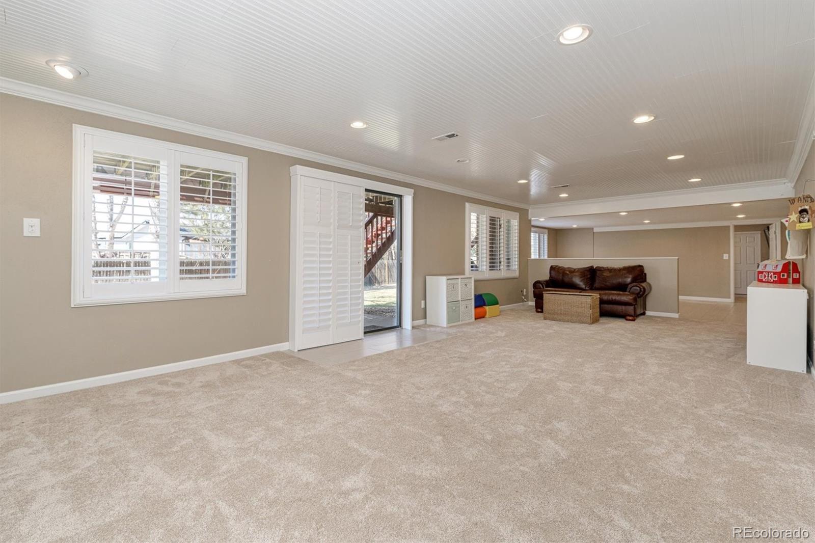 6145 South Eudora Way Centennial, CO 80121 - Photo 23 of 33 a view of livingroom with furniture and a window
