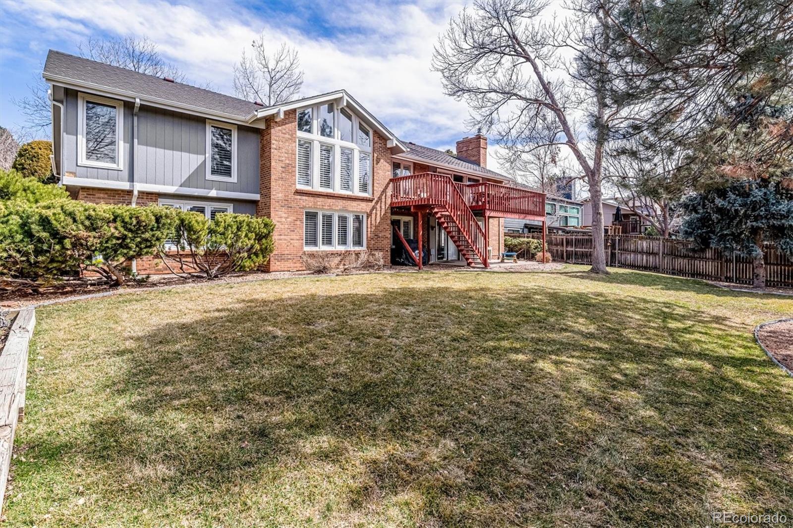6145 South Eudora Way Centennial, CO 80121 - Photo 29 of 33 a view of a house with a big yard and large tree
