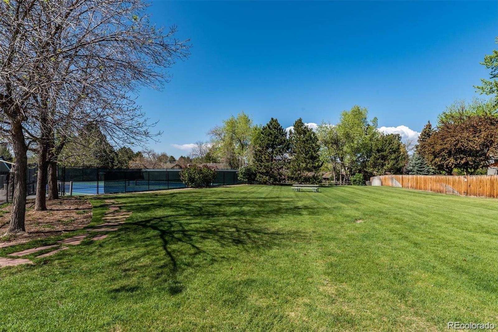 6145 South Eudora Way Centennial, CO 80121 - Photo 32 of 33 a backyard of a house with lots of green space